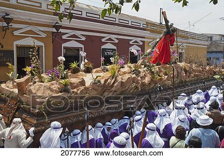 Stock Photograph - Men Carrying The Anda (Float) Of Jesus Carrying The Cross During The Procession Of The Holy Cross On Good Friday In Antigua Guatemala, Sacatep. Fotosearch