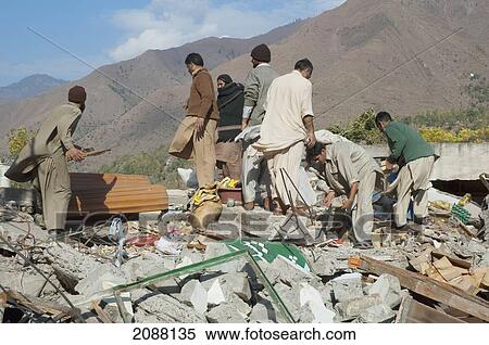 Men Digging For Corpses In The Ruins Of The Bazaar Destroyed By The 8 October 2005 Earthquake, Chinari, Azad Kashmir, Pakistan View Large Photo Image Stock Photography - Men Digging For Corpses In The Ruins Of The Bazaar Destroyed By The 8 October 2005 Earthquake, Chinari, Azad Kashmir, Pakistan. Fotosearch