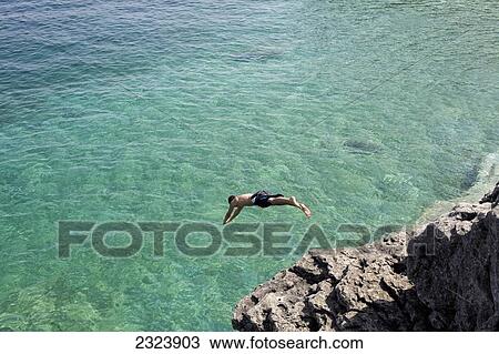 Men diving into the turquoise water of Georgian Bay in Bruce Peninsula National Park; Ontario, Canada View Large Photo Image Stock Image - Men diving into the turquoise water of Georgian Bay in Bruce Peninsula National Park; Ontario, Canada. Fotosearch