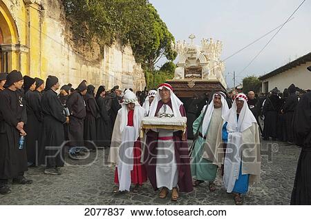 Men Dressed In Mourning Carrying The Anda (Float) Of The Last Supper During The Holy Burial Procession On Good Friday In Antigua Guatemala, Sacatep View Large Photo Image Stock Photo - Men Dressed In Mourning Carrying The Anda (Float) Of The Last Supper During The Holy Burial Procession On Good Friday In Antigua Guatemala, Sacatep. Fotosearch