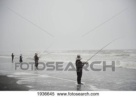 Men Fishing Along The Coast; Washington United States Of America View Large Photo Image Stock Photography - Men Fishing Along The Coast; Washington United States Of America. Fotosearch