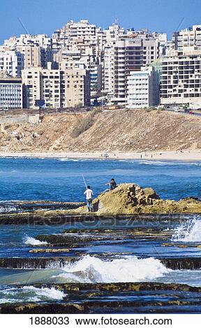 Men Fishing At Rafiq Hairiri Beach View Large Photo Image Stock Image - Men Fishing At Rafiq Hairiri Beach. Fotosearch