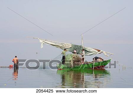 Stock Photography - Men Fishing From A Boat, Lake Qarun, El Fayoum, Egypt. Fotosearch