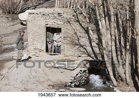 Stock Photo - Men In A Gristmill Near Zarkharid, Vardak Province, Afghanistan. Fotosearch