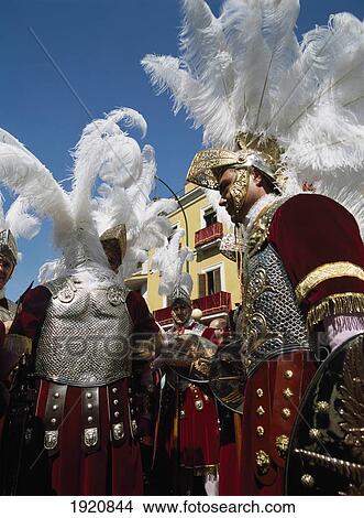 Picture - Men In Roman Soldier Costumes In Semana Santa Parade Through Seville, Andalucia, Spain. Fotosearch