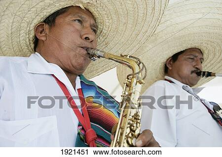 Stock Image - Men In Sombreros Performing At Holiday Resort In Mayan Riviera, Yucatan Peninsula, Quintana Roo State, Mexico. Fotosearch