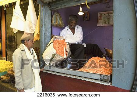 Stock Photography - Men In The Flower Stalls At Devaraja Market In Mysore, Karnataka, India. Fotosearch