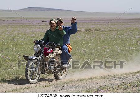 Stock Photograph - Men on a motorcycle, Gobi Gurvansaikhan National Park,? mnÃƒÆ’Ã‚Â·govi Province, Mongolia. Fotosearch