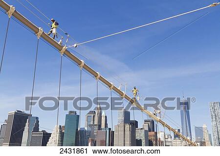 Men painting a suspension cable of the Brooklyn Bridge, New York City, New York, United States View Large Photo Image Stock Image - Men painting a suspension cable of the Brooklyn Bridge, New York City, New York, United States. Fotosearch