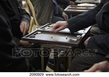 Stock Photo - Men Playing Backgammon Game In The Sha'ab Chai Khana [Teahouse], Sulaymaniyah, Iraqi Kurdistan, Iraq. Fotosearch
