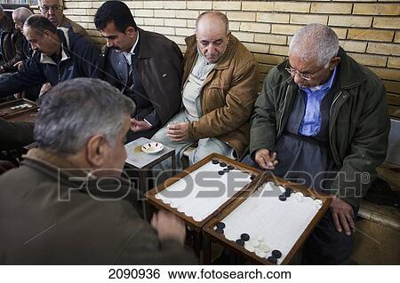 Stock Photograph - Men Playing Backgammon In The Sha'ab Chai Khana [Teahouse], Sulaymaniyah, Iraqi Kurdistan, Iraq. Fotosearch