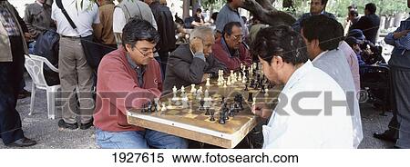 Stock Photography - Men Playing Chess In Park. Fotosearch