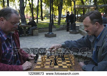 Men playing chess in Shevchenko Park; Kiev, Ukraine View Large Photo Image Stock Image - Men playing chess in Shevchenko Park; Kiev, Ukraine. Fotosearch