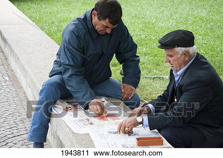 Stock Image - Men Playing Domino, Tirana, Albania. Fotosearch