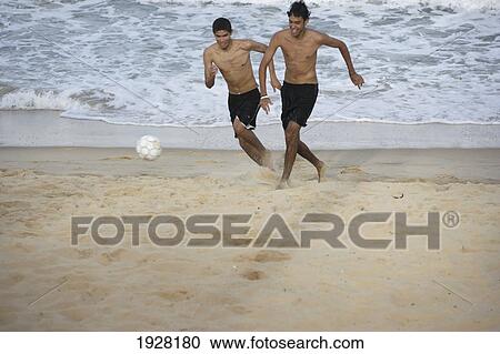 Men Playing Football On A Beach, Brazil View Large Photo Image Stock Image - Men Playing Football On A Beach, Brazil. Fotosearch