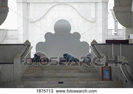 Men Praying At The Top Of The Steps; Kuala Lumpur, Malaysia View Large Photo Image Stock Image - Men Praying At The Top Of The Steps; Kuala Lumpur, Malaysia. Fotosearch