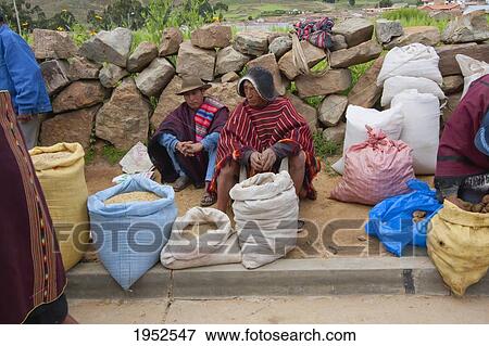 Stock Photo - Men selling cereals by street, Bolivia. Fotosearch