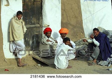 Stock Photograph - Men sitting and talking together, Shapura Bagh Village; Rajasthan, India. Fotosearch