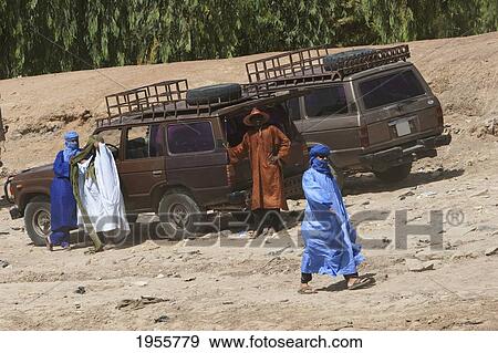 Stock Photo - Men Standing By Cars Waiting On The Banks Of The Niger River In Kabara, The Port Of Timbuktu, Mali. Fotosearch