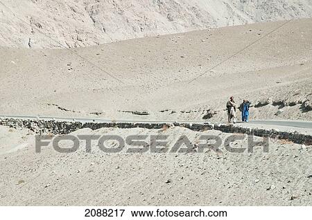 Men Walking Along The Road In The Shyok Valley, Northern Areas, Pakistan View Large Photo Image Stock Photo - Men Walking Along The Road In The Shyok Valley, Northern Areas, Pakistan. Fotosearch