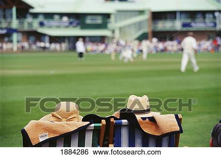 Stock Photograph - Men Watching Cricket Game. Fotosearch