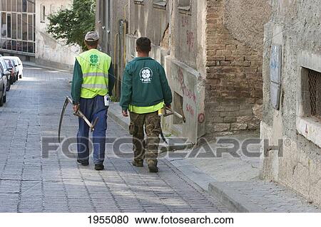 Men With Sickles Walking Down A Street, Sarajevo, Bosnia And Herzegovina View Large Photo Image Stock Image - Men With Sickles Walking Down A Street, Sarajevo, Bosnia And Herzegovina. Fotosearch