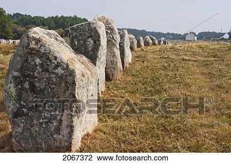 Stock Image - Menhirs In The The Menec Alignments, Carnac, Morbihan, France. Fotosearch
