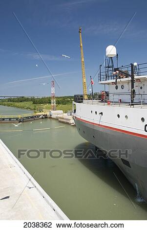 Stock Image - Merchant Ship Going Through A Lock; St. Catharines Ontario Canada. Fotosearch