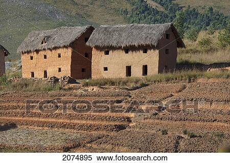Stock Photography - Merina Houses And Rice Fields Along The Road Between Ambositra & Ambavalao, Fianarantsoa Province, Madagascar. Fotosearch