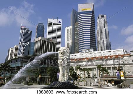 Stock Image - Merlion In Front Of Singapore Business District. Fotosearch