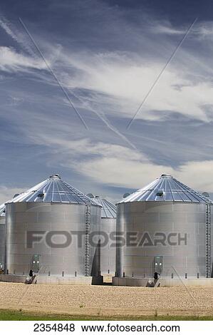 Stock Photo - Metal Grain Bins; Alberta, Canada. Fotosearch