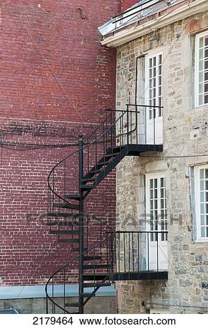 Picture - Metal Staircase Going Up The Side Of A Building; Montreal Quebec Canada. Fotosearch