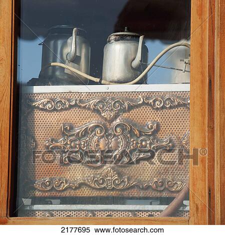 Stock Photography - Metal Teapots Sitting Inside A Window; Ortahisar Nevsehir Turkey. Fotosearch