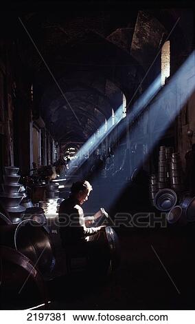 Stock Image - Metal Worker at a bazaar, Shiraz, Iran.. Fotosearch