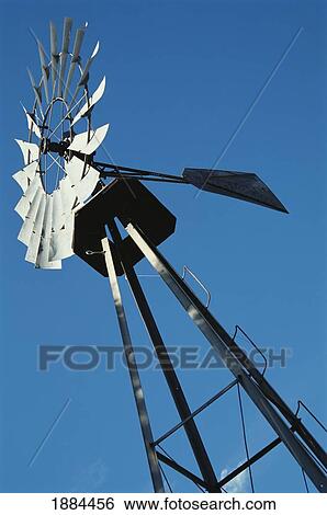Metallic Windmill Against Blue Sky View Large Photo Image Stock Photograph - Metallic Windmill Against Blue Sky. Fotosearch
