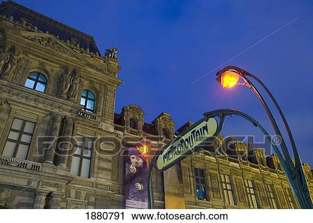 Metro Sign And The Louvre At Dusk. View Large Photo Image Stock Image - Metro Sign And The Louvre At Dusk.. Fotosearch
