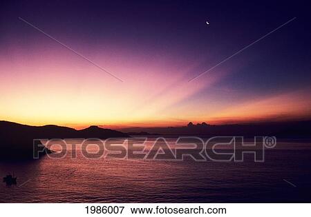 Mexico, Acapulco Bay, Colorful Sunset On Horizon, Crescent Moon In Sky. View Large Photo Image Stock Photo - Mexico, Acapulco Bay, Colorful Sunset On Horizon, Crescent Moon In Sky.. Fotosearch