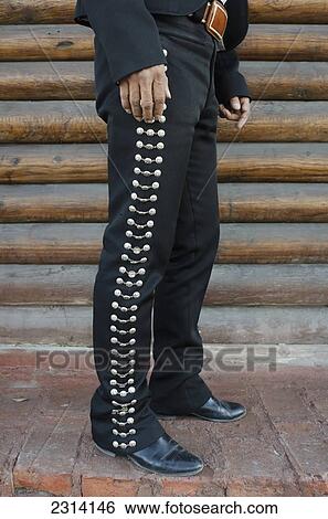 Stock Photograph - Mexico, Aguascalientes, Aguascalientes, Man wearing mariachi costume. Fotosearch