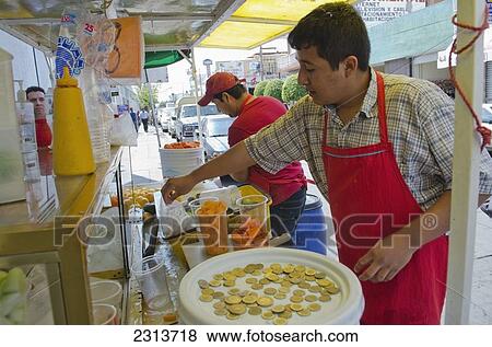Mexico, Aguascalientes state, Aguascalientes, Street side vendor preparing fruit cup View Large Photo Image Stock Photo - Mexico, Aguascalientes state, Aguascalientes, Street side vendor preparing fruit cup. Fotosearch