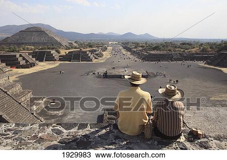 Stock Image - Mexico, Avenue of the Dead; Teotihuacan Archeological Site, Tourist looking at Pyramid of the Moon. Fotosearch