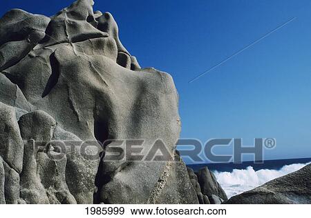 Stock Photo - Mexico, Cabo San Lucas, Blue Ocean And Crashing Wave, Rocky Formations In Foreground.. Fotosearch