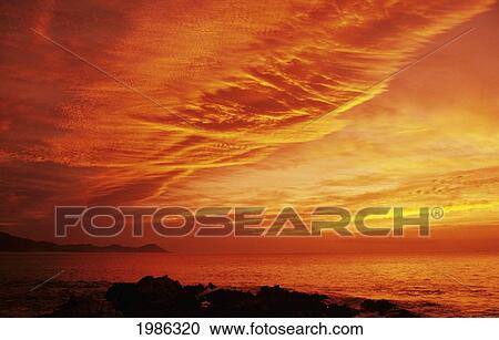 Stock Image - Mexico, Cabo San Lucas, Gorgeous Orange Sunset Over Ocean.. Fotosearch