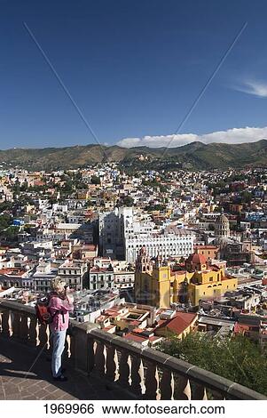 Mexico, Guanajuato, Guanajuato City, Yellow Church Basilica Of Our Lady Of Guanajuato (Basilica De Nuestra Senora De Guanajuato) Tourist In Foreground. View Large Photo Image Stock Photograph - Mexico, Guanajuato, Guanajuato City, Yellow Church Basilica Of Our Lady Of Guanajuato (Basilica De Nuestra Senora De Guanajuato) Tourist In Foreground.. Fotosearch