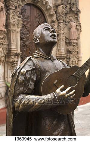 Stock Photography - Mexico, Guanajuato, Guanajuato City, Bronze Statue Of A Singing Mexican, In Front Of The Temple Of San Diego.. Fotosearch