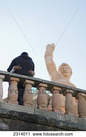Mexico, Guanajuato, Guanajuato, Couple standing against railing by Pipila statue View Large Photo Image Stock Image - Mexico, Guanajuato, Guanajuato, Couple standing against railing by Pipila statue. Fotosearch