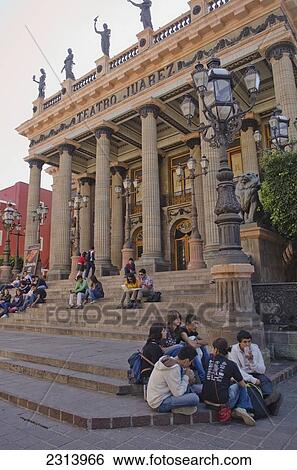 Mexico, Guanajuato, Guanajuato, Group of people sitting on stairs of Teatro Juarez theatre View Large Photo Image Stock Photograph - Mexico, Guanajuato, Guanajuato, Group of people sitting on stairs of Teatro Juarez theatre. Fotosearch