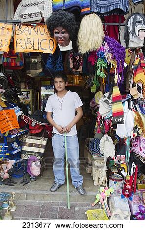 Mexico, Guanajuato State, Guanajuato, Portrait of boy standing in front of his souvenir shop View Large Photo Image Stock Photo - Mexico, Guanajuato State, Guanajuato, Portrait of boy standing in front of his souvenir shop. Fotosearch