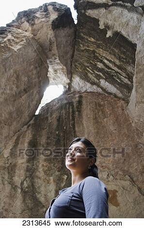 Stock Photography - Mexico, Guanajuato State, Guanajuato, Young woman in caves of La Bufa. Fotosearch