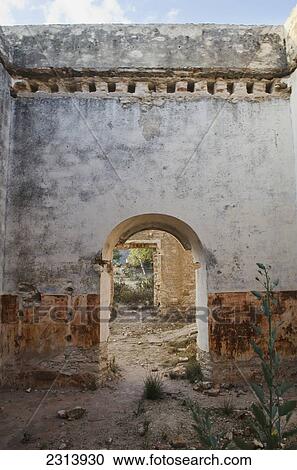 Stock Image - Mexico, Guatajuato, Pozos, Doorway in old ruins wall. Fotosearch