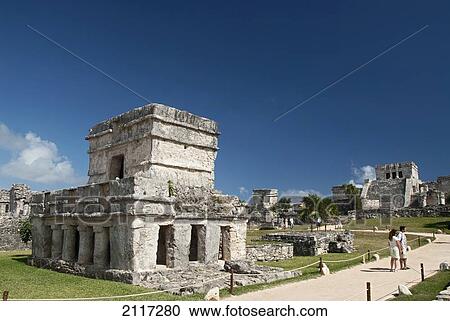 Mexico, Quintana Roo, Tulum, the Mayan ruins of Tulum, Templo de las Pinturas (Temple of Pictures), El Castillo (the Castle) in the background (right), tourist viewing the ruins View Large Photo Image Stock Image - Mexico, Quintana Roo, Tulum, the Mayan ruins of Tulum, Templo de las Pinturas (Temple of Pictures), El Castillo (the Castle) in the background (right), tourist viewing the ruins. Fotosearch